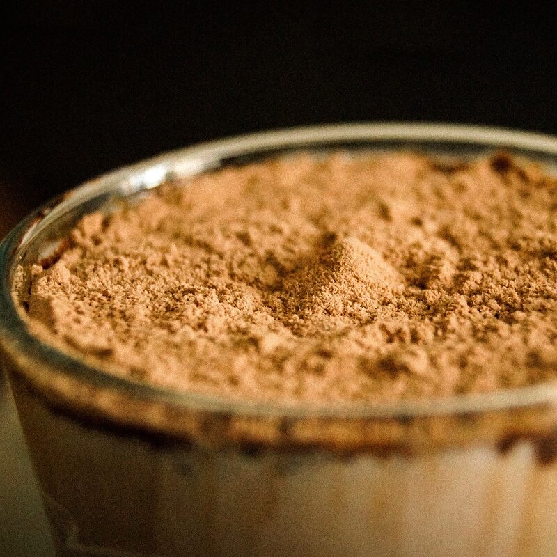 Close-up of a glass filled with chocolate milk powder