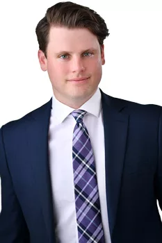 Professional man in business suit with blue tie and checked shirt